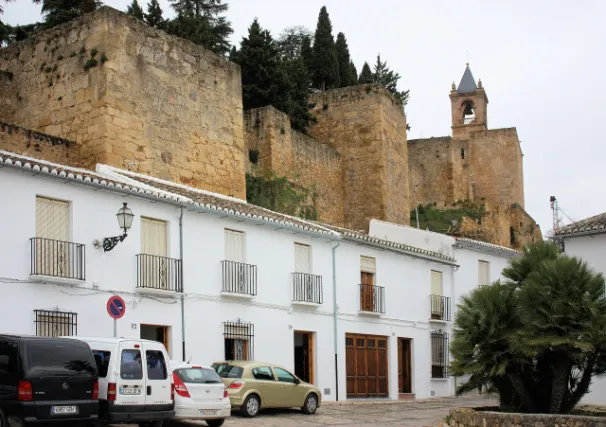 Antequera, a row of houses on the Calle de Herradores and the Alcazaba
