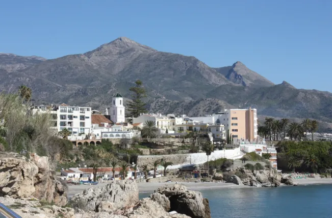 Nerja, view to the beach "Playa El Salón" and to the Church of El Salvador